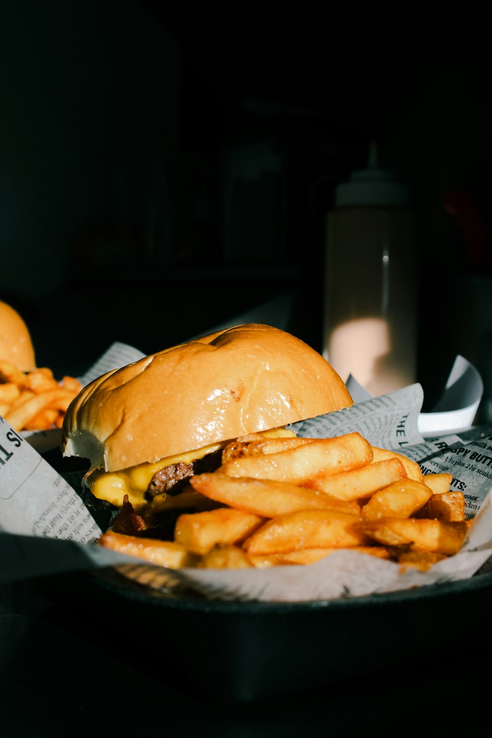 burger and fries on white paper