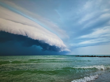 ocean waves under blue sky during daytime