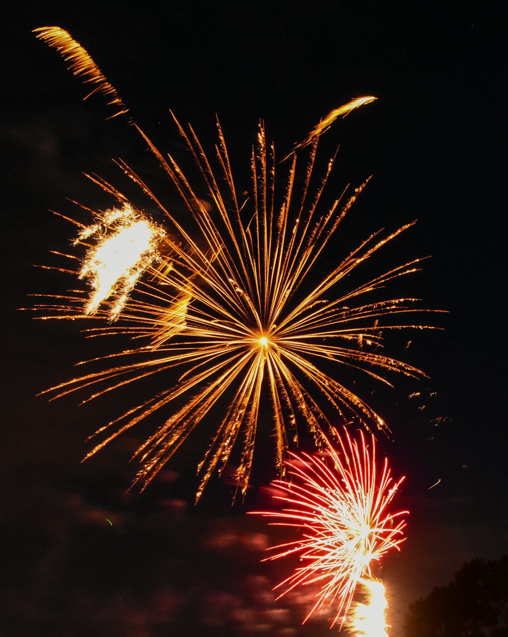 yellow fireworks in the sky during night time