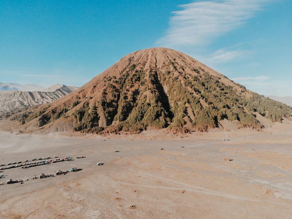 brown mountain under blue sky during daytime