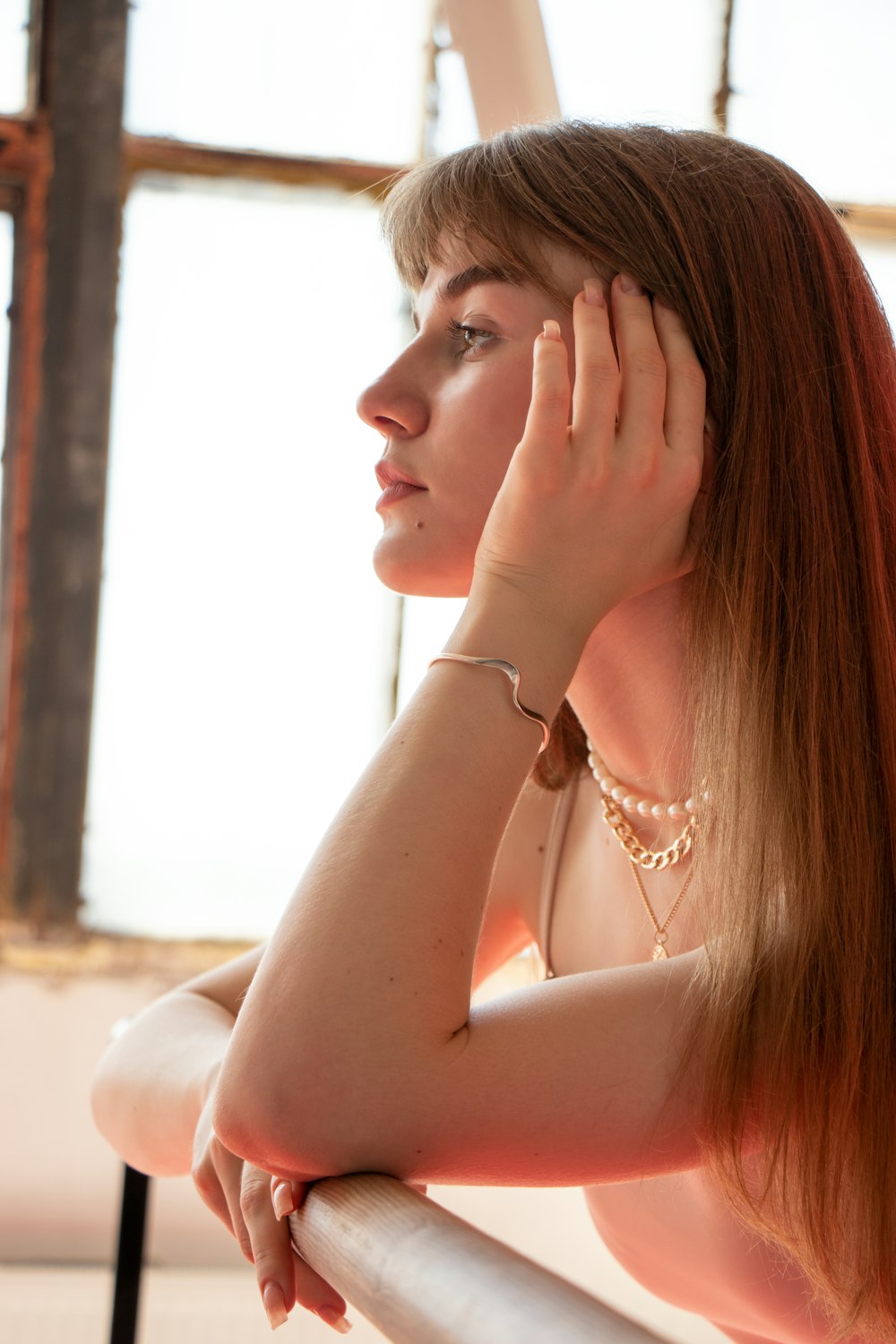 woman in white pearl necklace