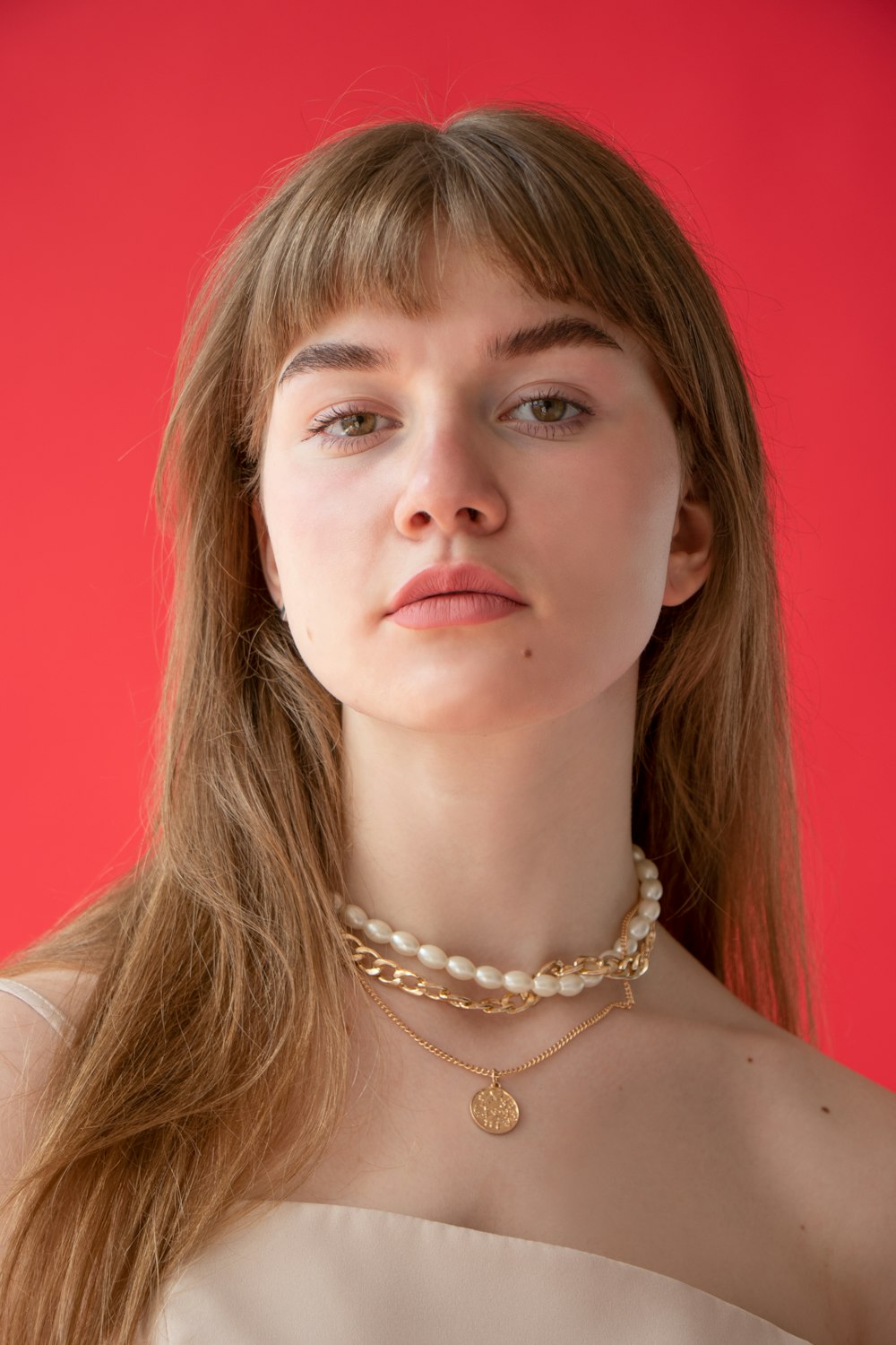 woman in silver necklace and silver necklace