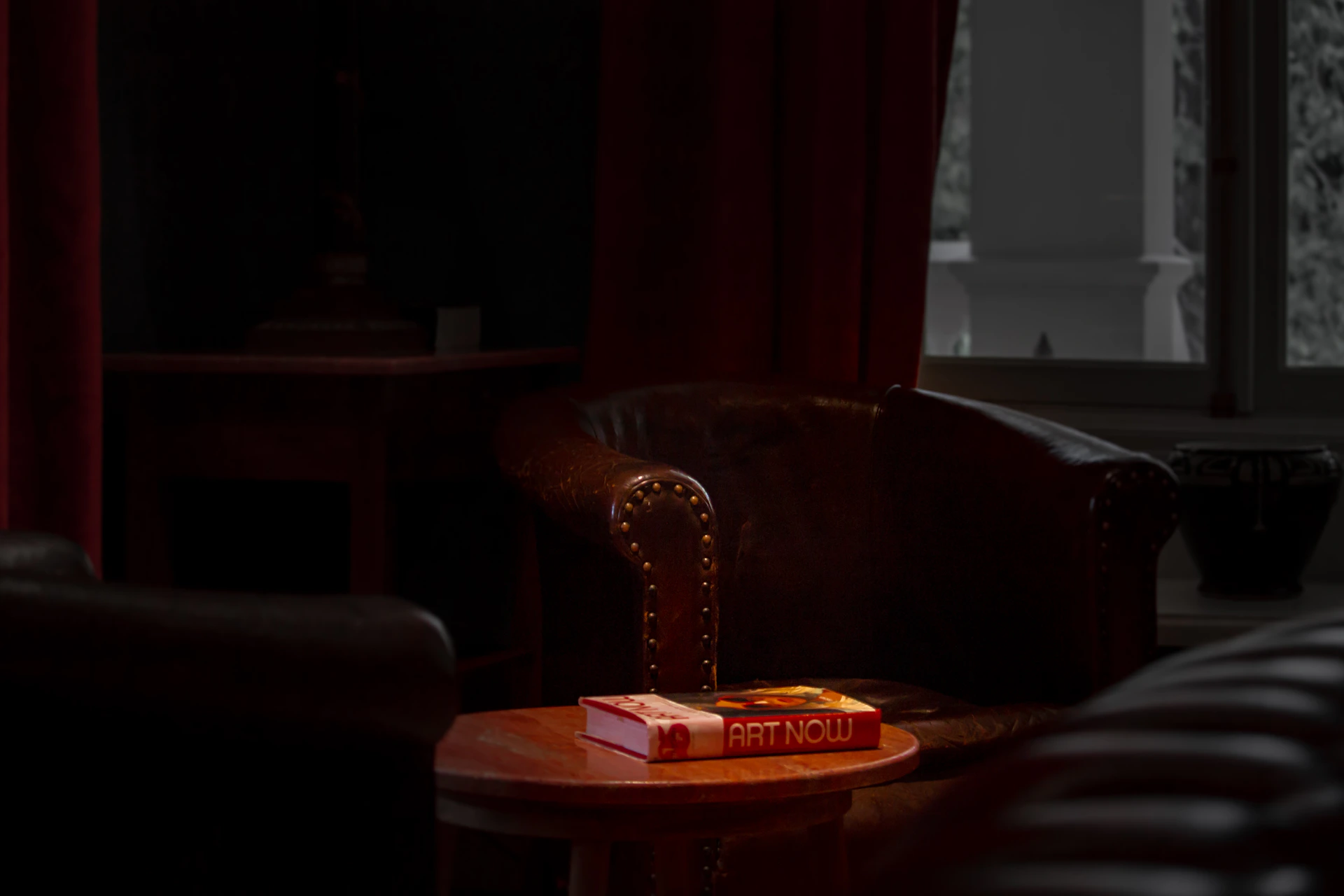 red and yellow book on brown wooden table