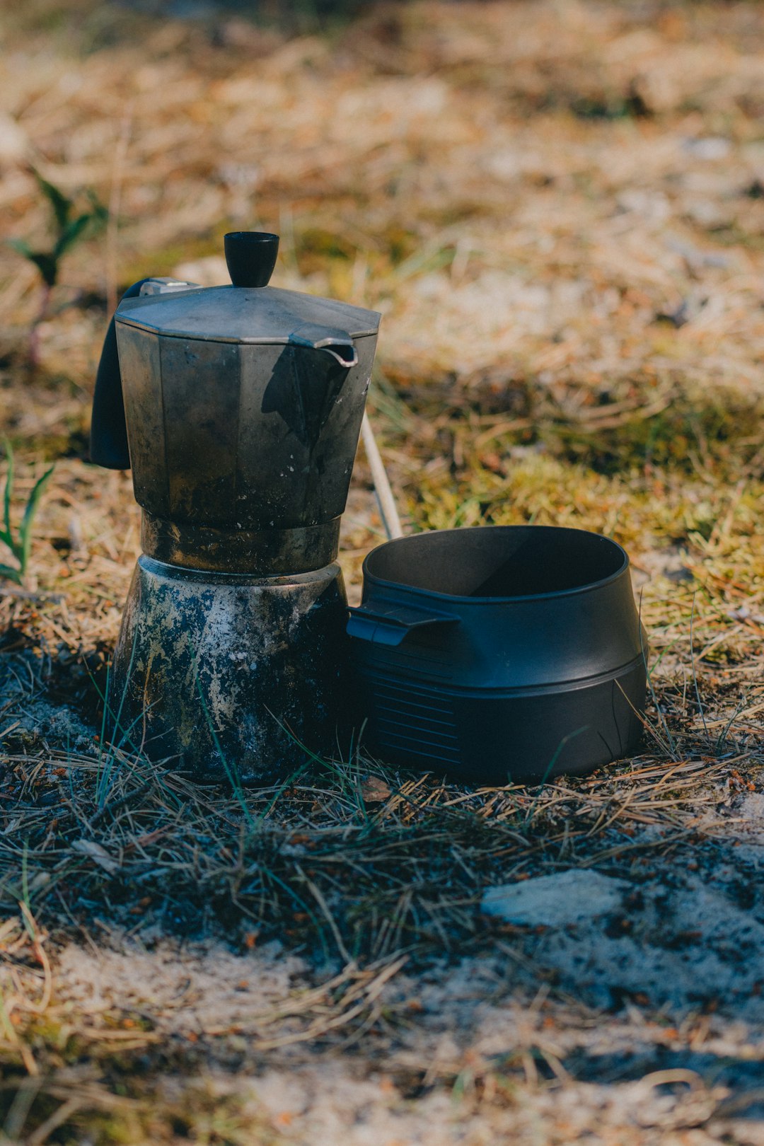 black metal candle holder on ground