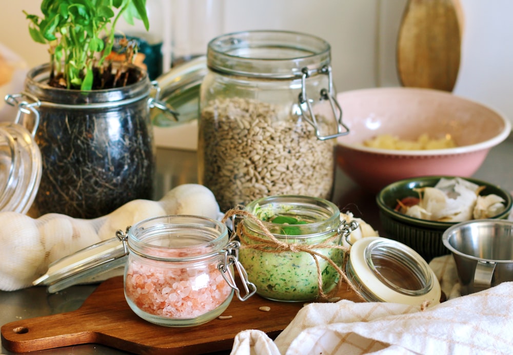 clear glass jar with green liquid inside