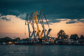 brown and white ship on dock during sunset