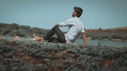 A serene outdoor setting with a person contemplating scientific concepts.
