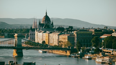 A scenic view of a famous European landmark with students studying nearby.