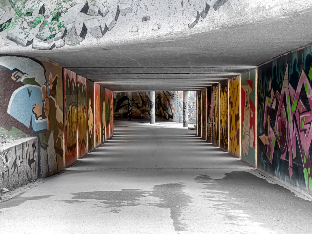 gray concrete road with graffiti