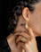 woman in gold diamond ring and black shirt