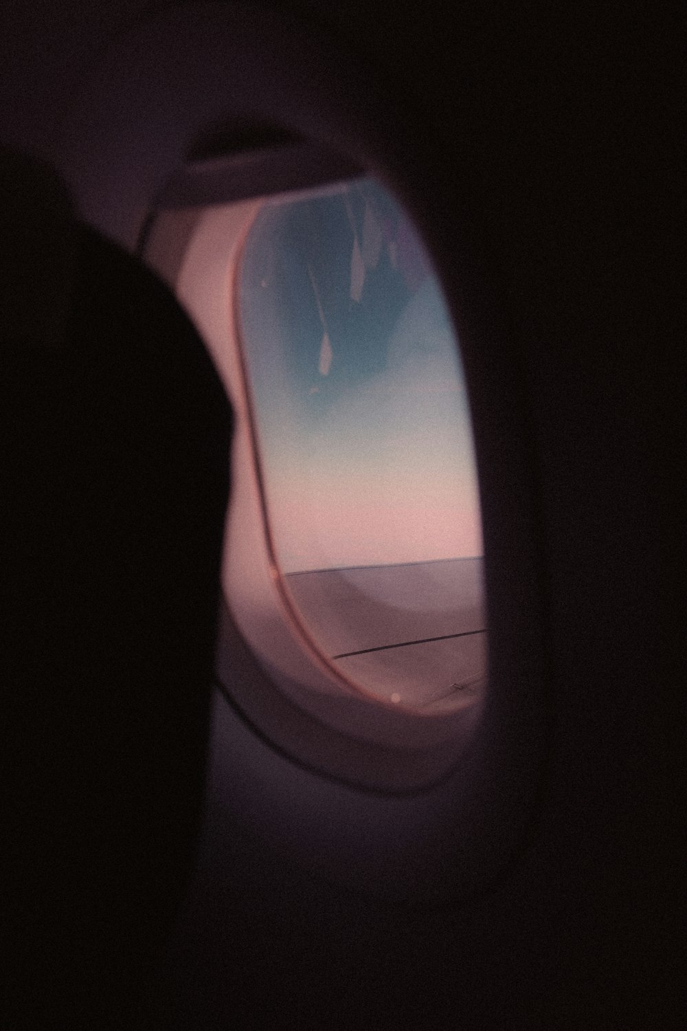 airplane window view of white clouds during daytime