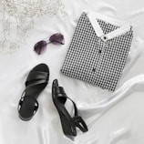 black and white checkered box beside black leather peep toe sandals