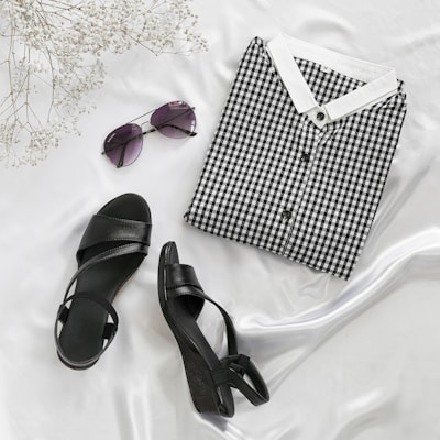 black and white checkered box beside black leather peep toe sandals
