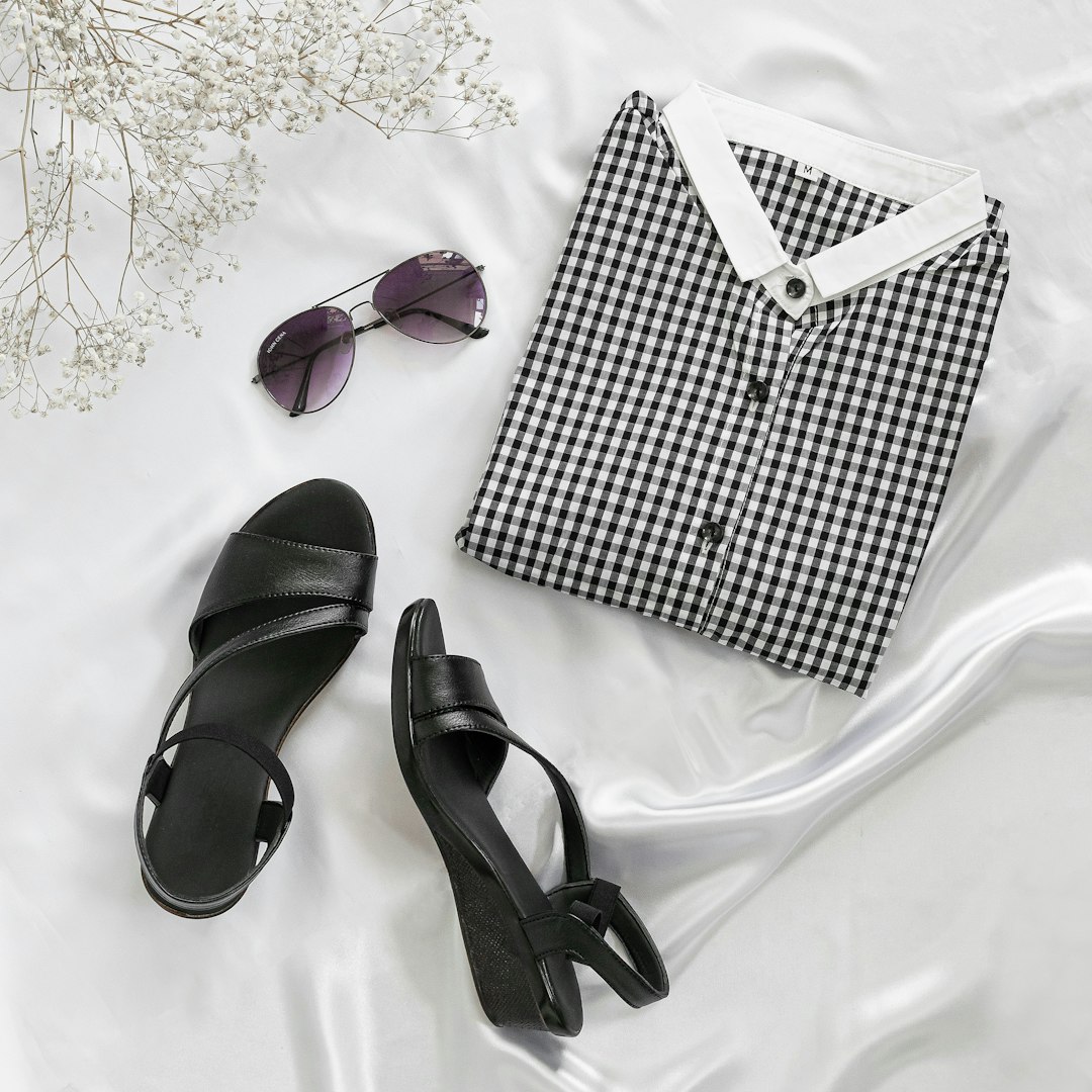 black and white checkered box beside black leather peep toe sandals