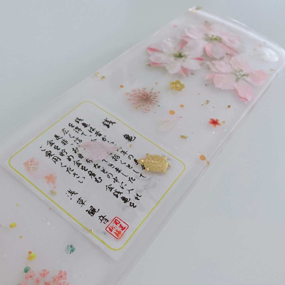 white pink and green floral plastic pack