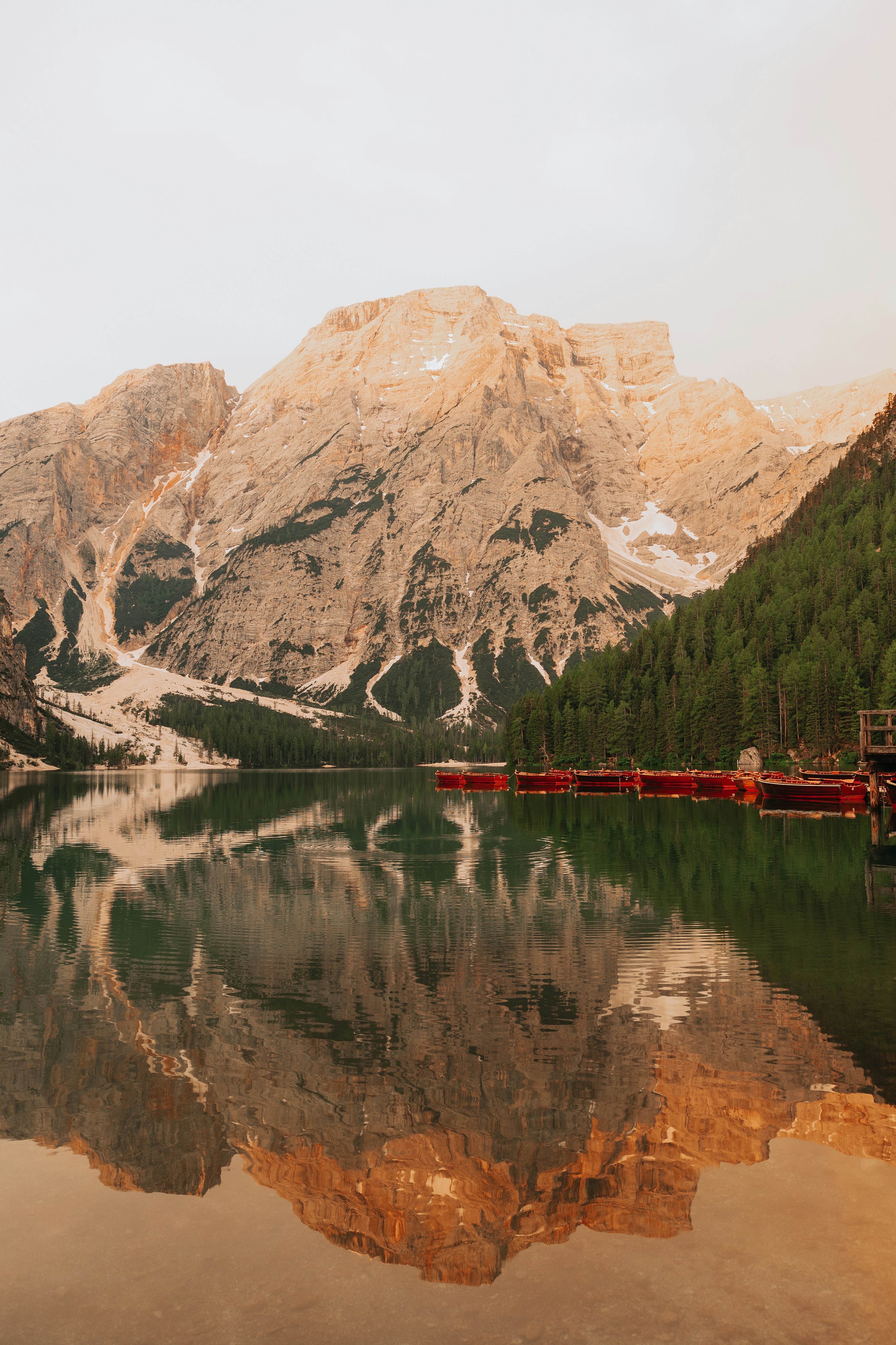 Brown and white mountain near body of water during daytime photo – Free ...