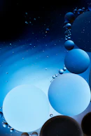 blue and white balloons with blue and green lights