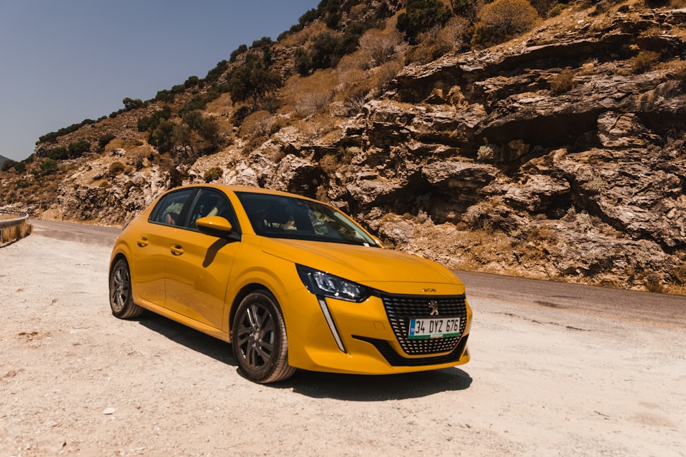 yellow audi a 4 on a desert