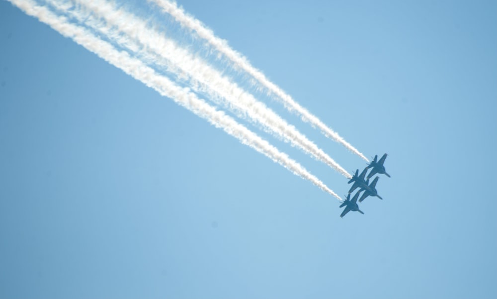 black jet plane in mid air during daytime