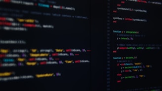 Computer screen displaying multicolored code, representing computational models in systems biology