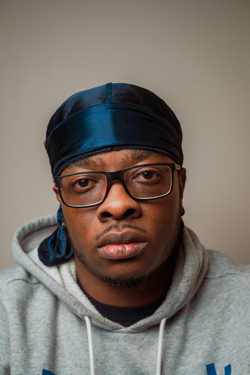 man in black knit cap and white hoodie