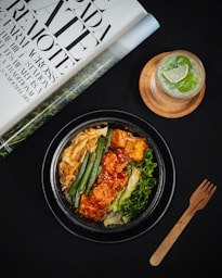 black ceramic plate with brown wooden chopsticks