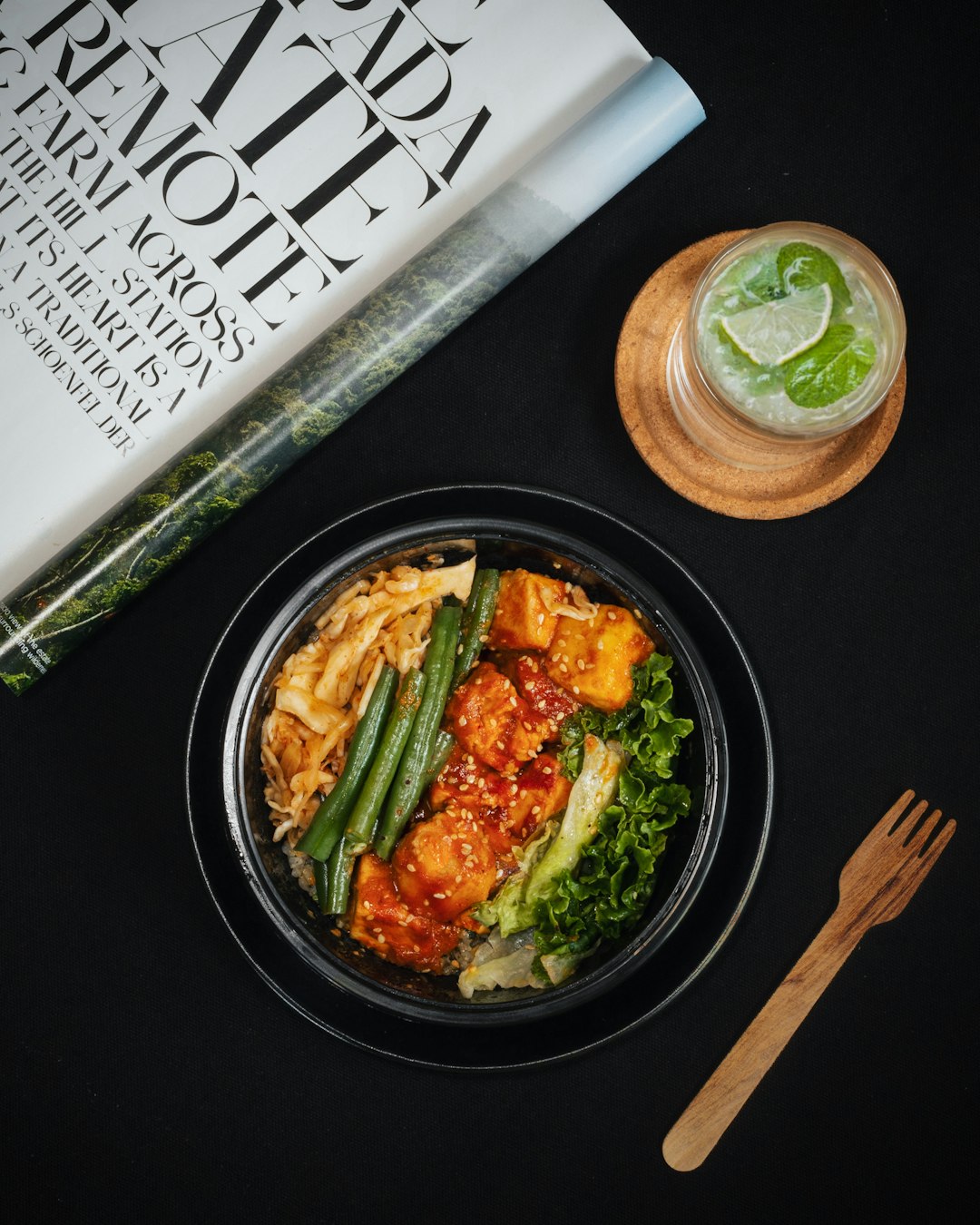 black ceramic plate with brown wooden chopsticks