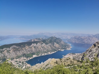 aerial view of green mountains and blue sea during daytime