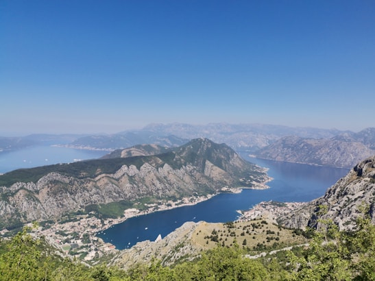 aerial view of green mountains and blue sea during daytime