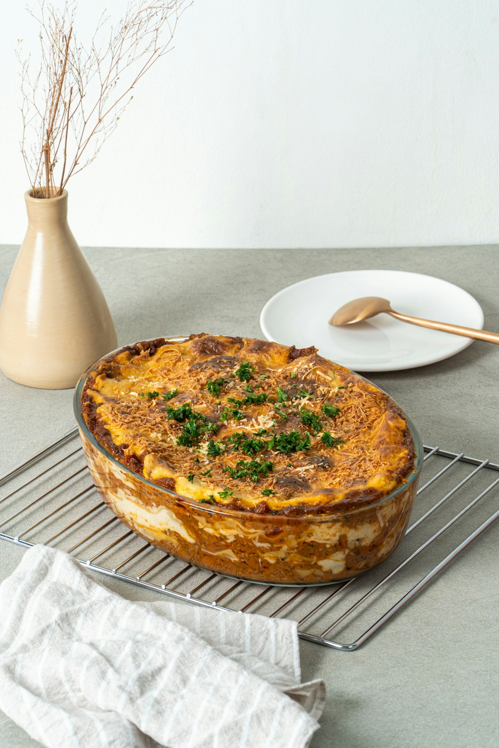 pie on white ceramic plate beside white ceramic plate with stainless steel fork