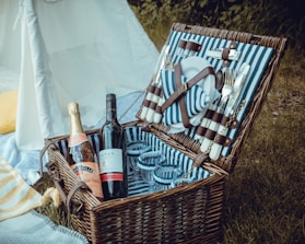 wine bottles in brown woven basket