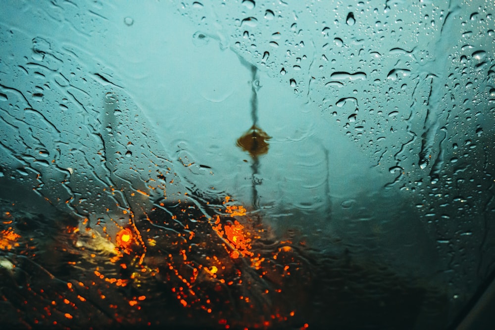 water droplets on glass during night time