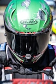 a close up of a person wearing a HJC helmet