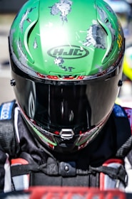a close up of a person wearing a HJC helmet
