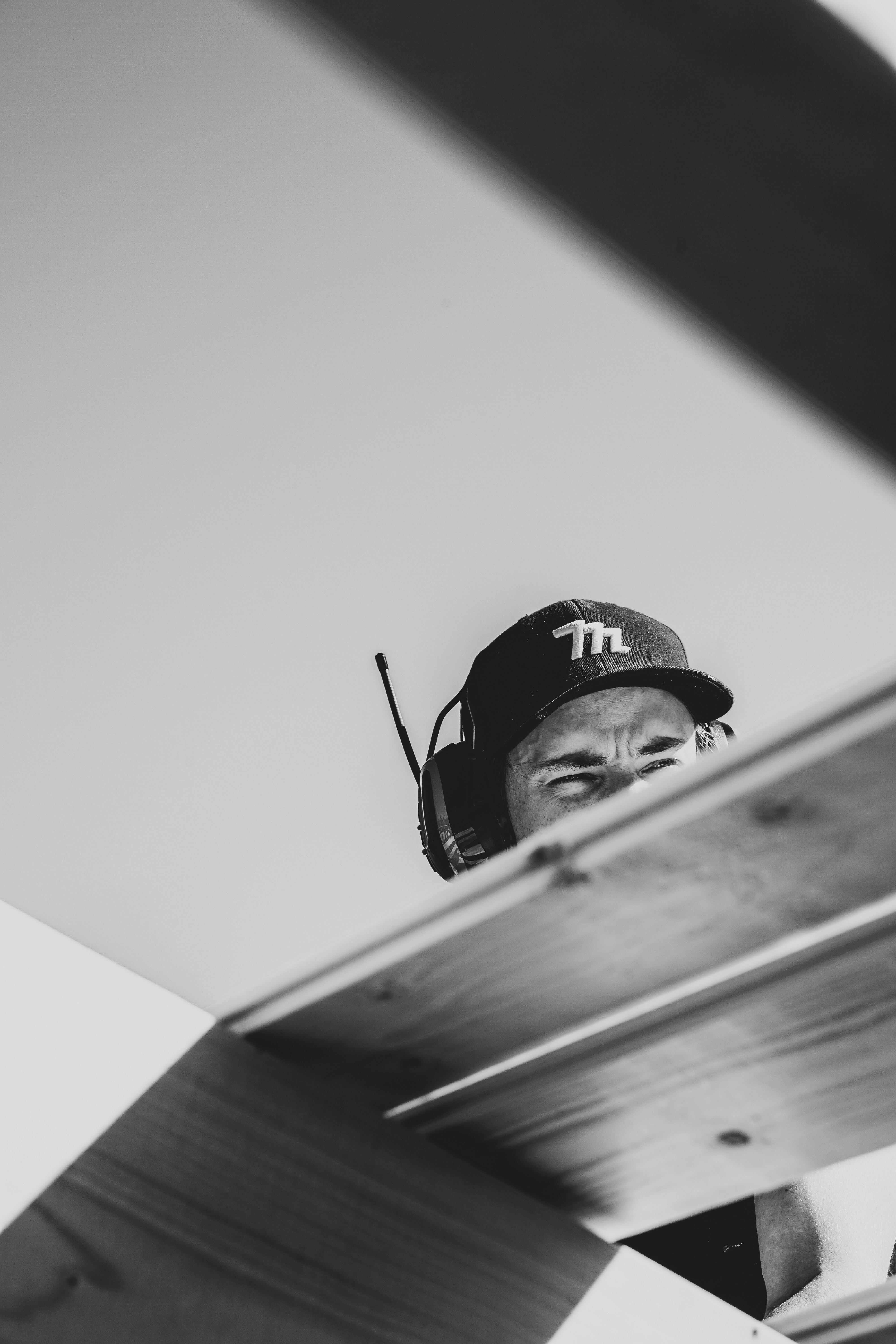 a man wearing a hat and holding a baseball bat