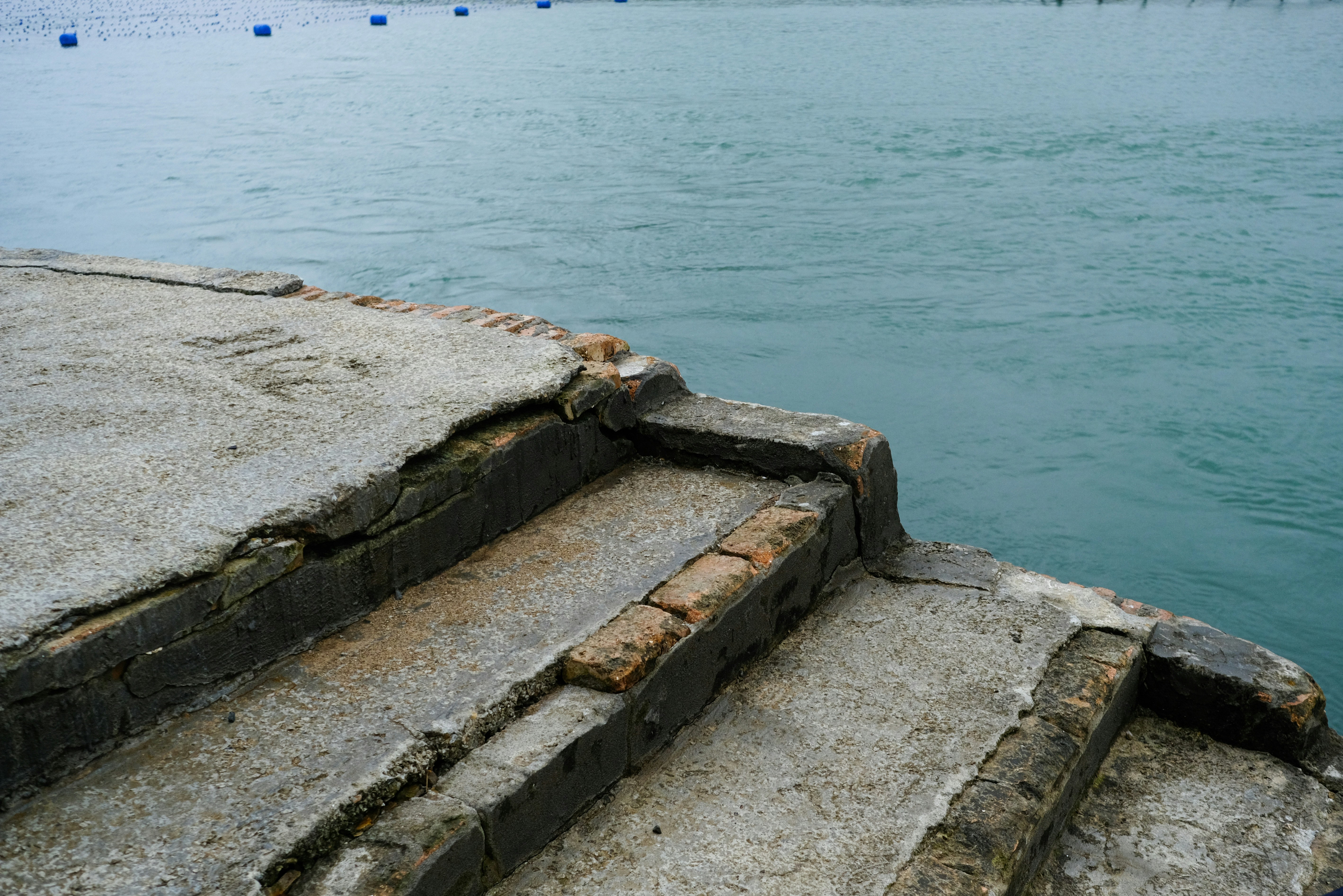 cracked concrete piling on a dock - dock repair near me