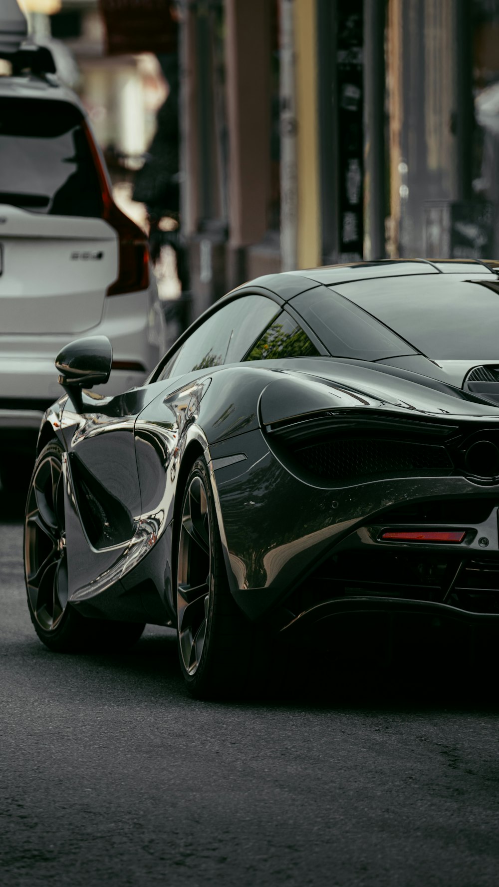 black mercedes benz coupe parked on street during daytime