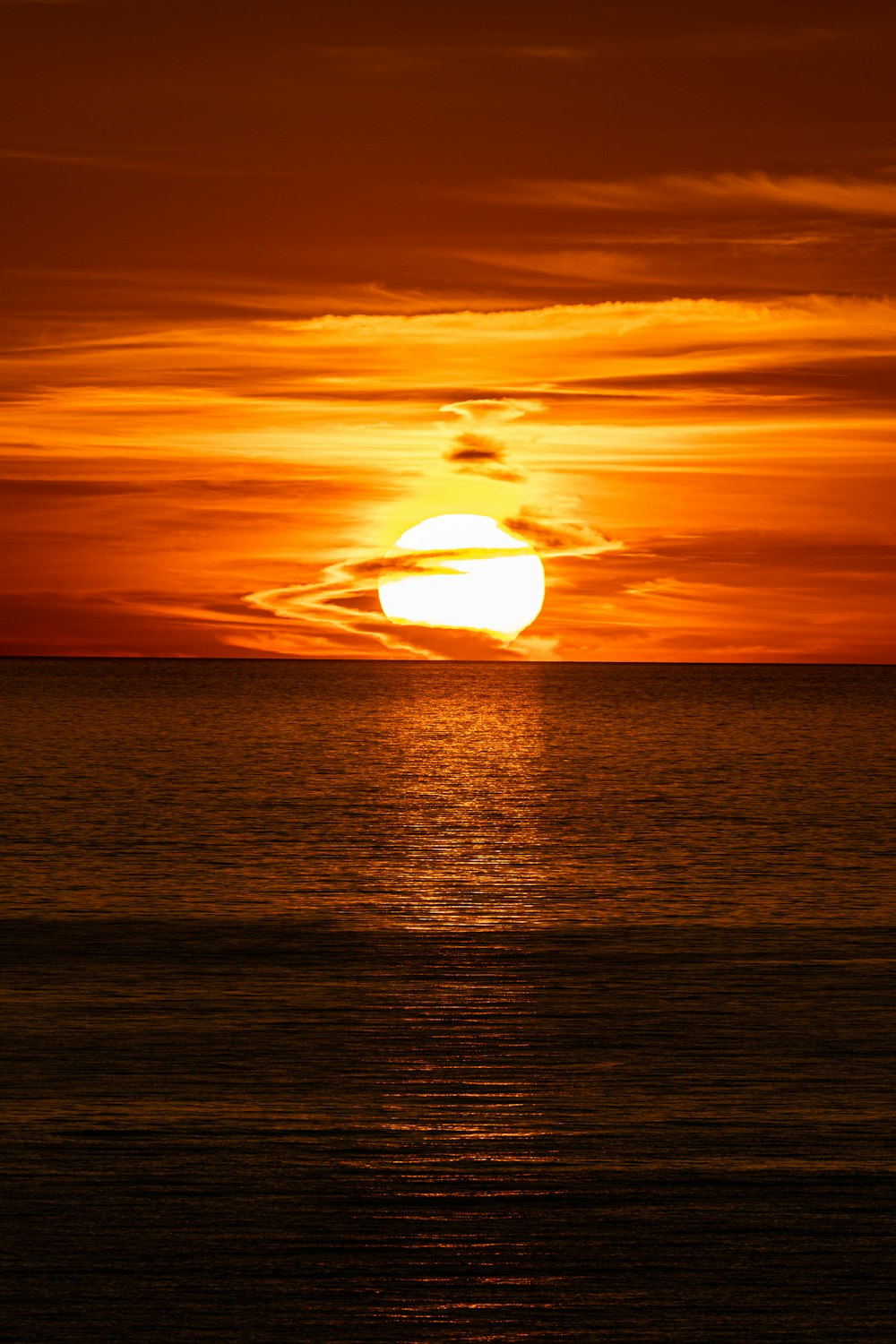 sunset over the sea with clouds