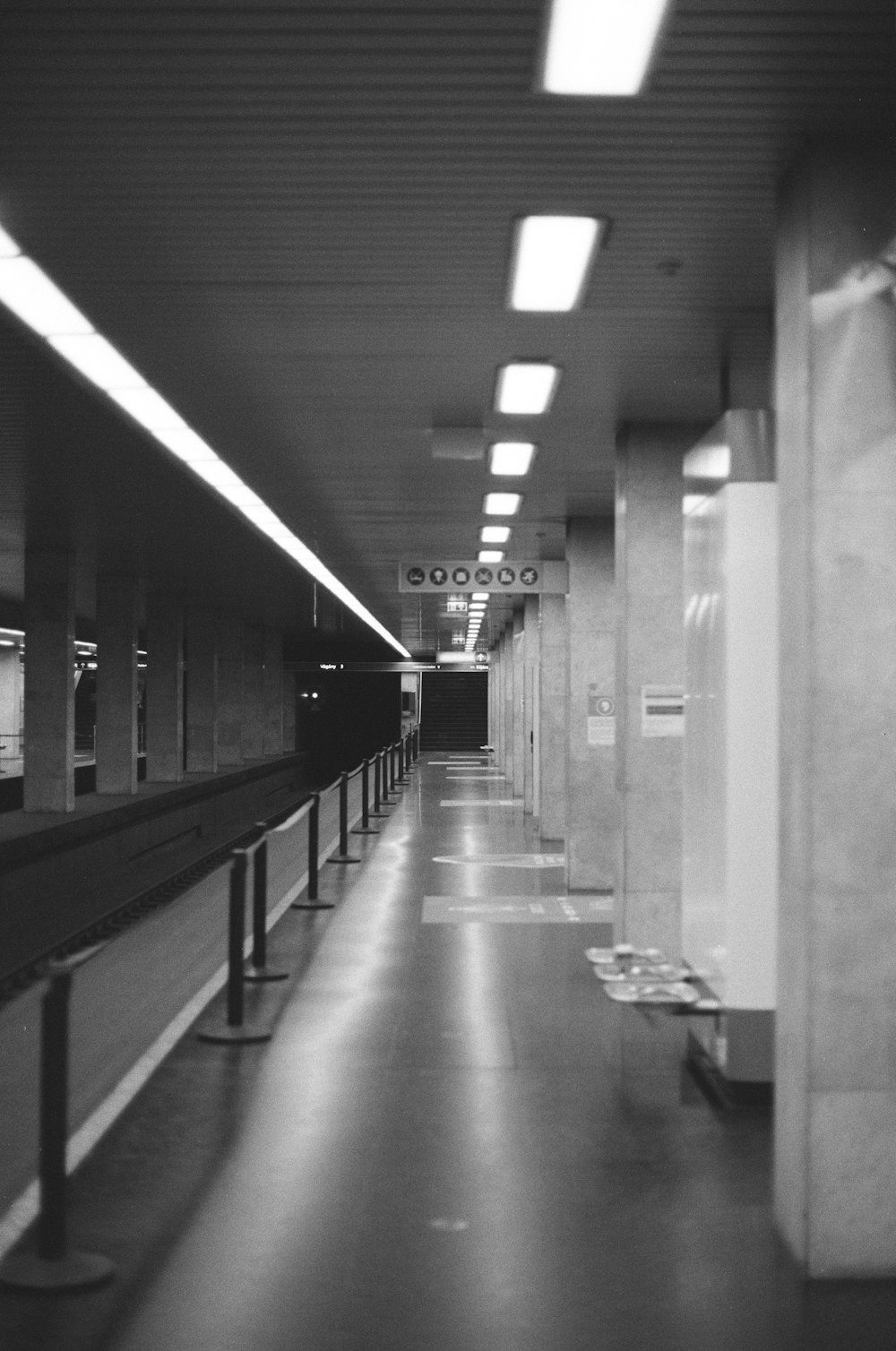 grayscale photo of hallway with no people