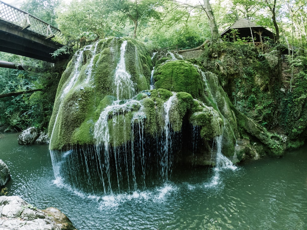 a small waterfall in the middle of a river