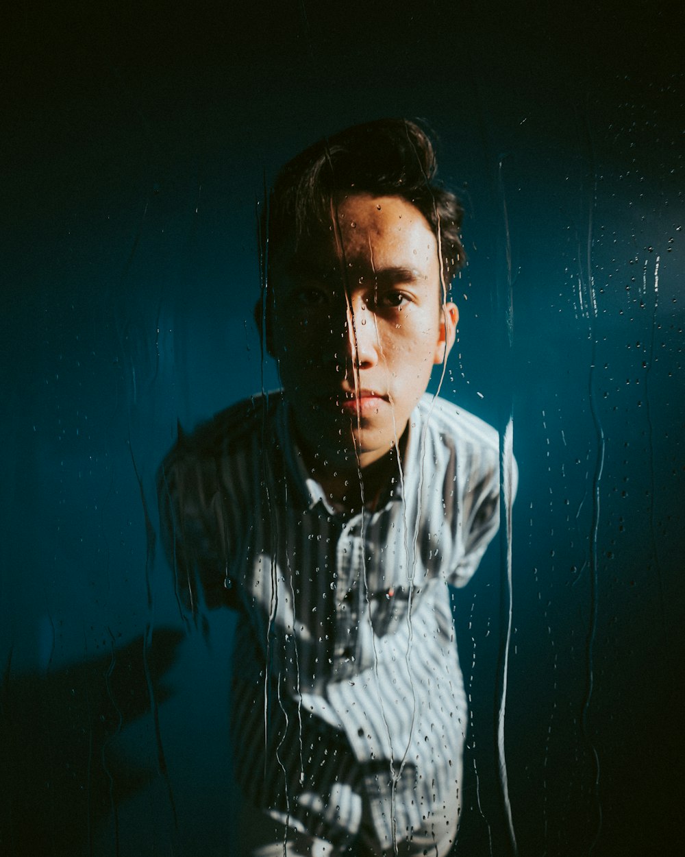 man in white and black striped hoodie