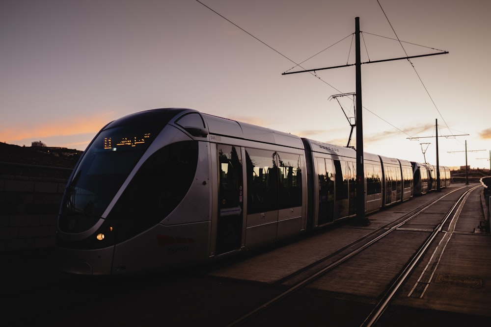 white and black train on rail