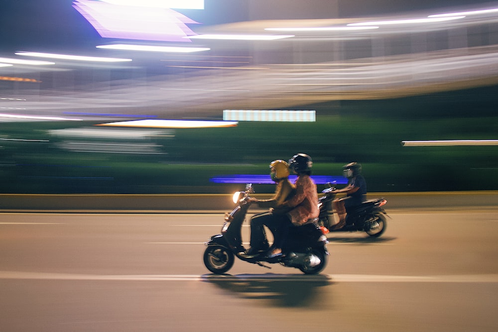 man in blue jacket riding motorcycle on road during daytime