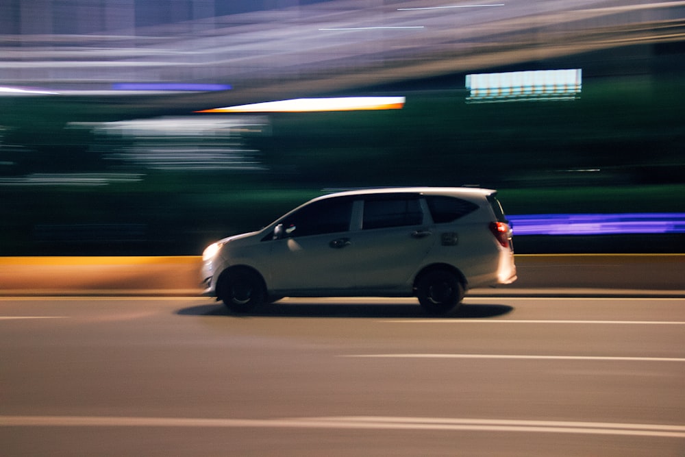 white 5 door hatchback on road