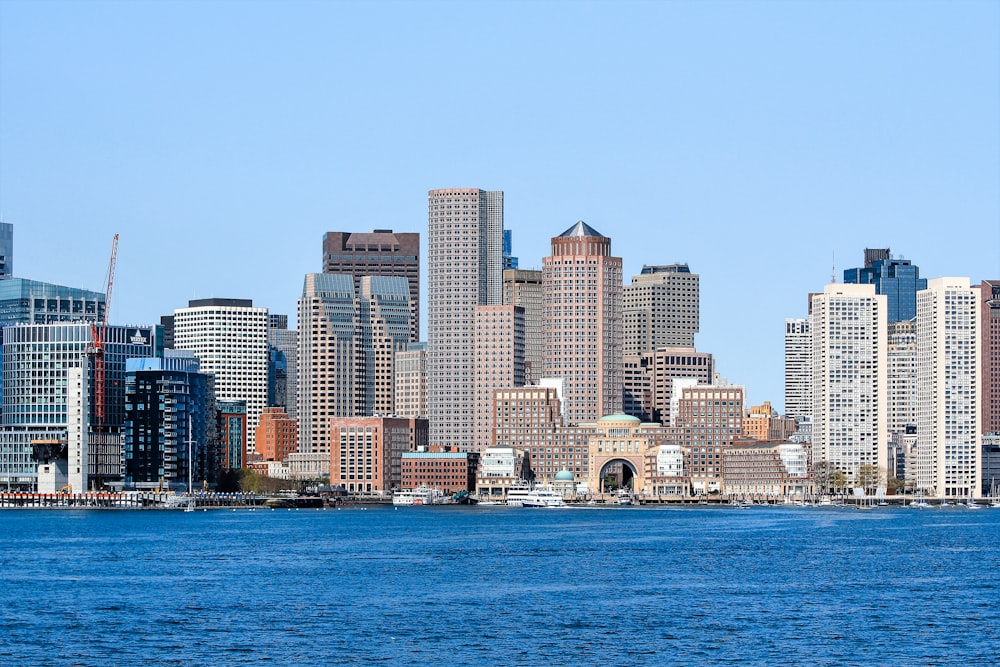 city skyline across body of water during daytime