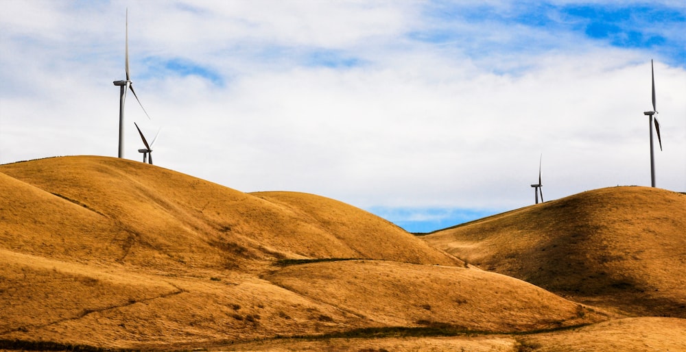 brown mountain under white clouds during daytime