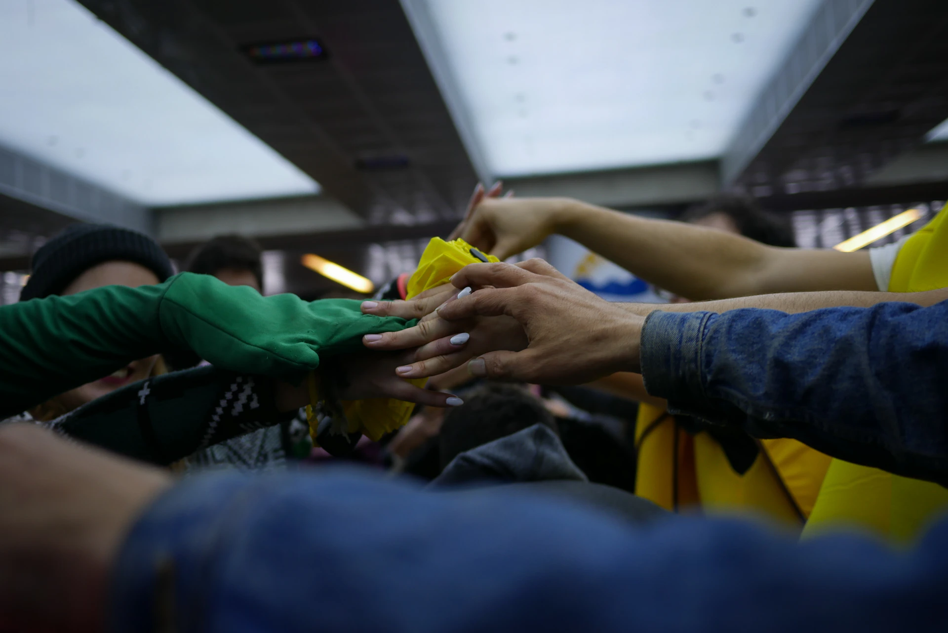 people in green shirt sitting on chair