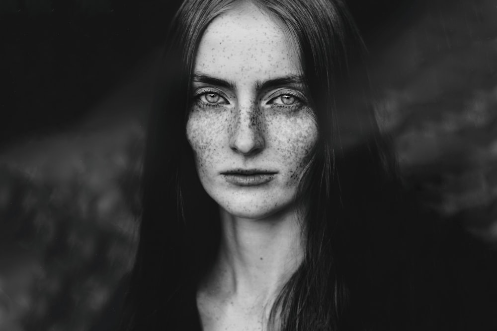 grayscale photo of womans face