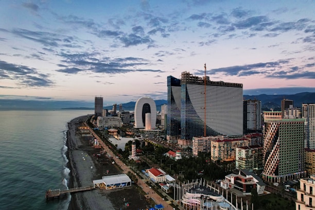city skyline under cloudy sky during daytime