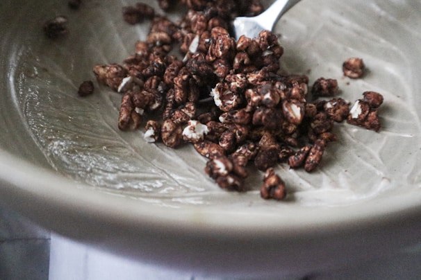 Rich chocolate-flavored roasted wheat germ sprinkled over a bowl of fresh fruit.